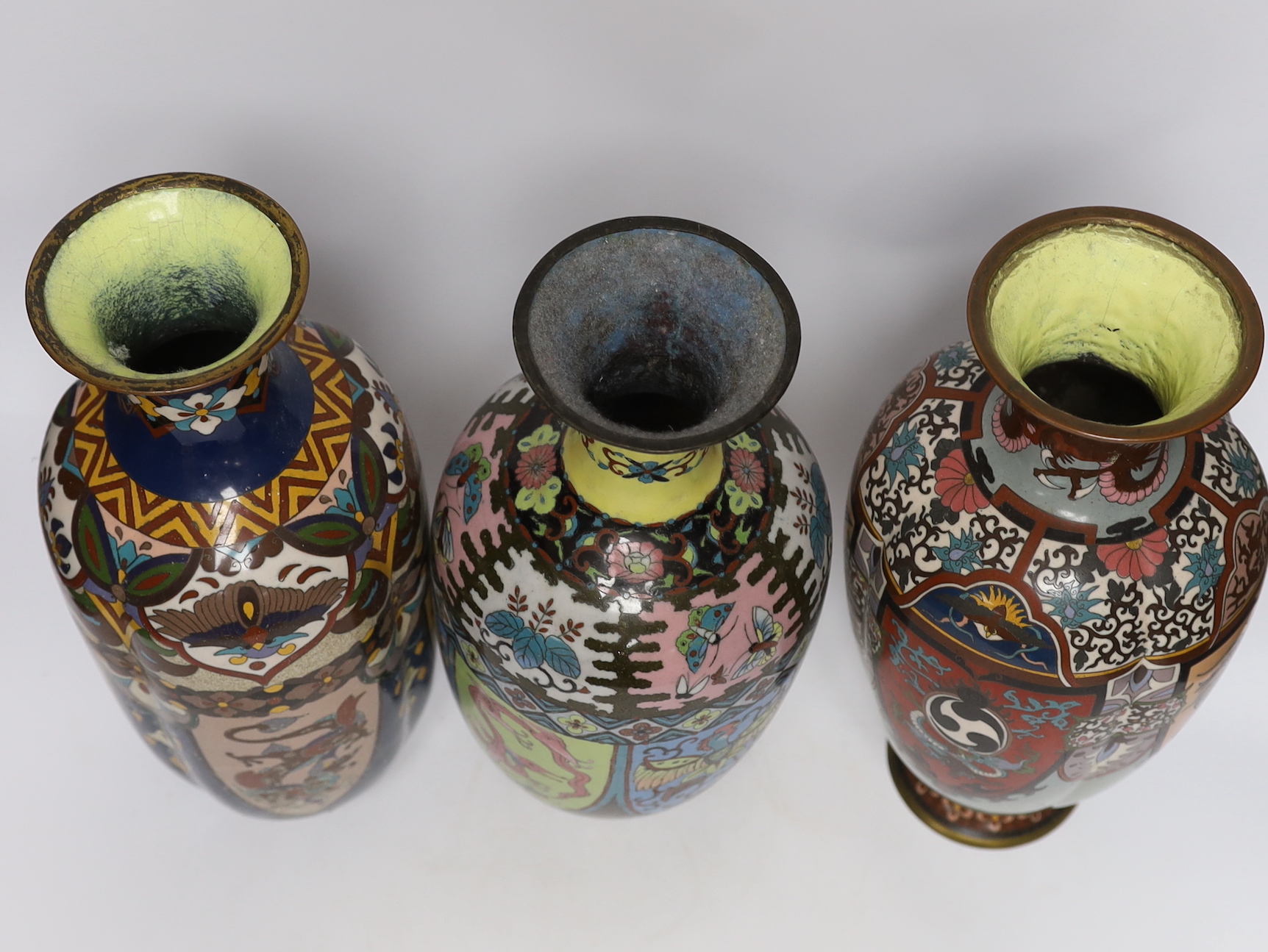 A pair of large Japanese cloisonné enamel vases, together with three similar vases, early 20th century, tallest 36.5cm high (5)